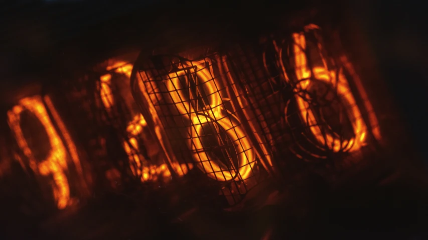 the letters are glowing orange on the side of an oven