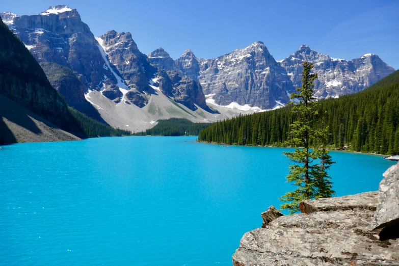 a blue body of water surrounded by mountains