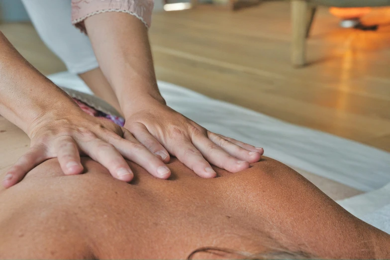 someone getting a back massage in a room