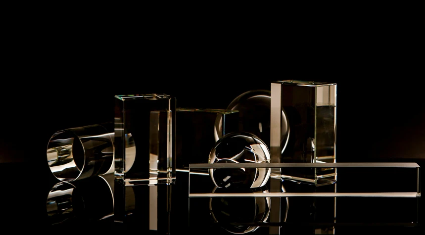 some small mirrored objects stacked together on a table