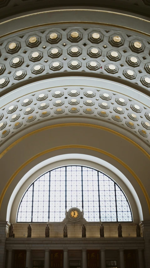 the ceiling of a building with a glass window