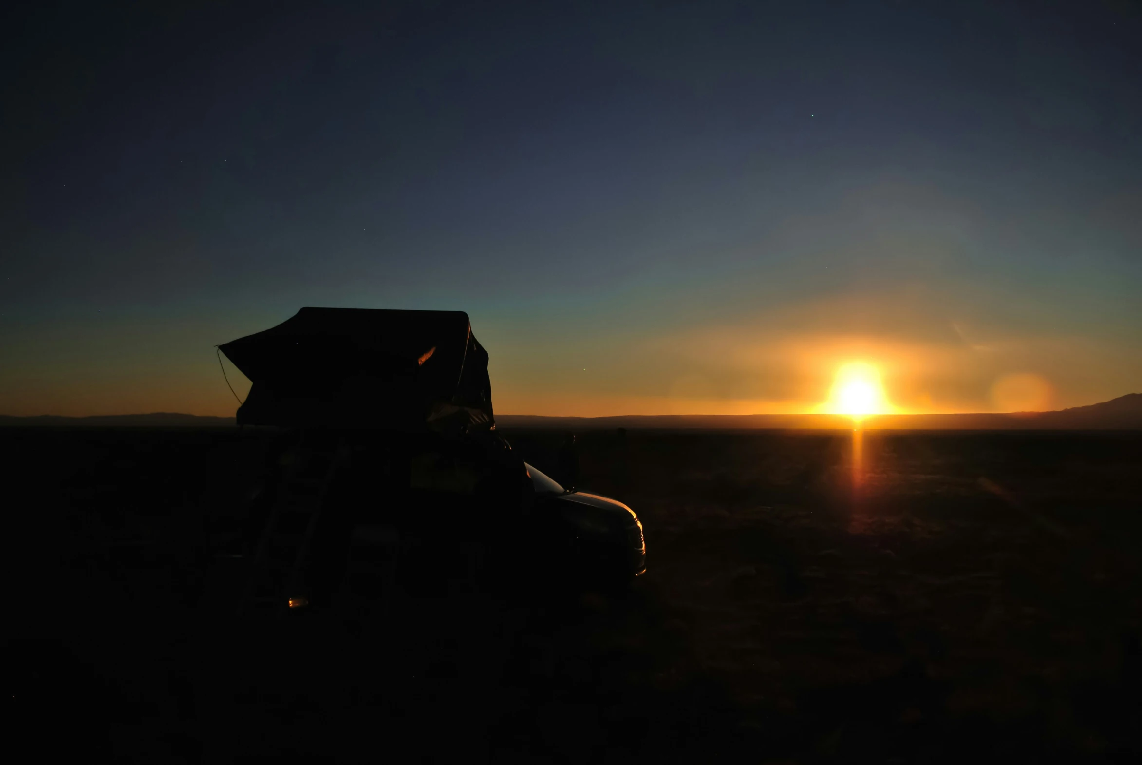 an image of a car in the sunset