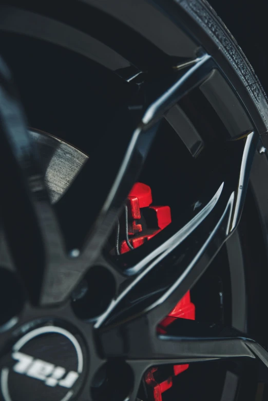 a close up po of the spokes on the wheels of a car