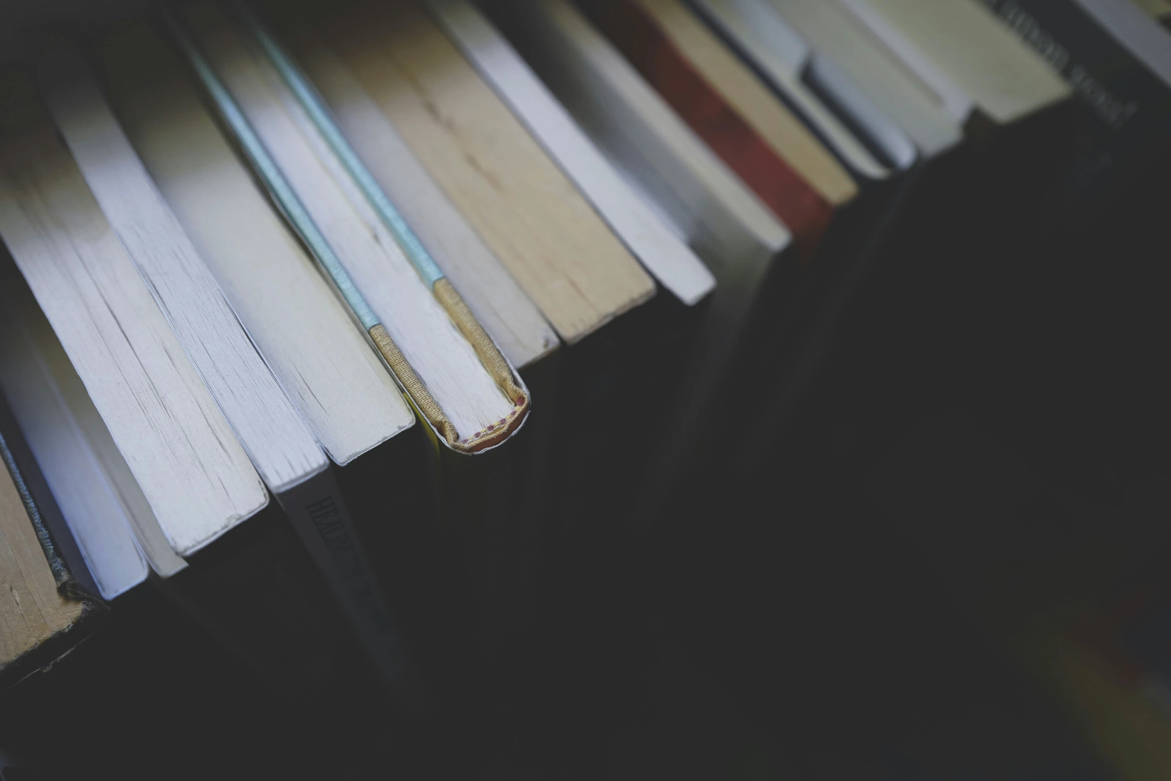 an up close view of books stacked in rows