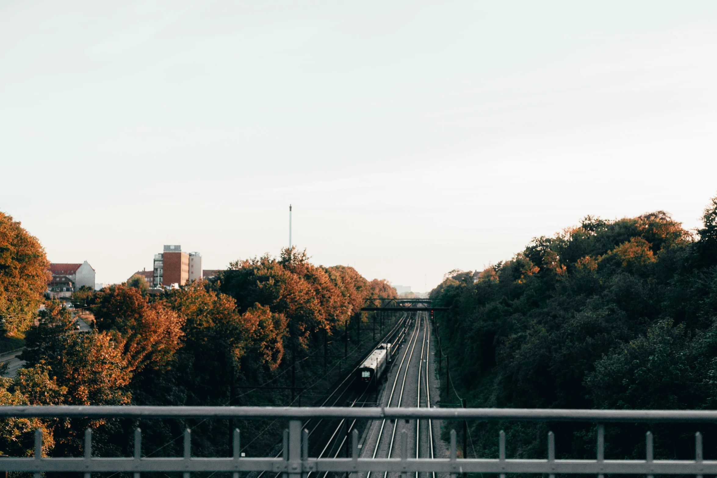 a train going down tracks in a city