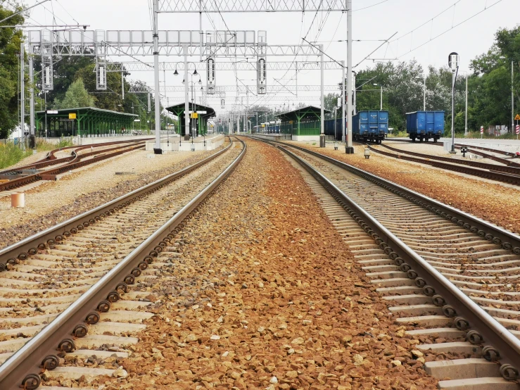 two train tracks with the same set on one side, next to the other