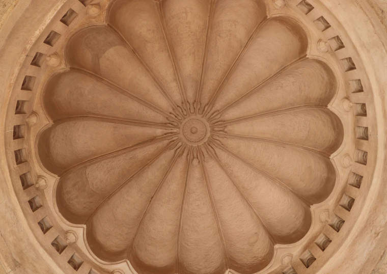 a large ornate round decorative ceiling in an old building