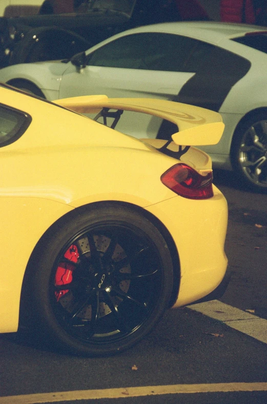 the sports car sits parked in front of another one