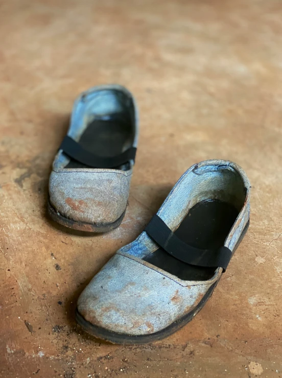 a pair of shoes sitting on top of a wooden floor