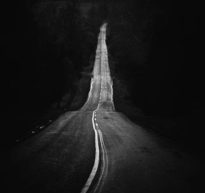 a night scene of a single long road