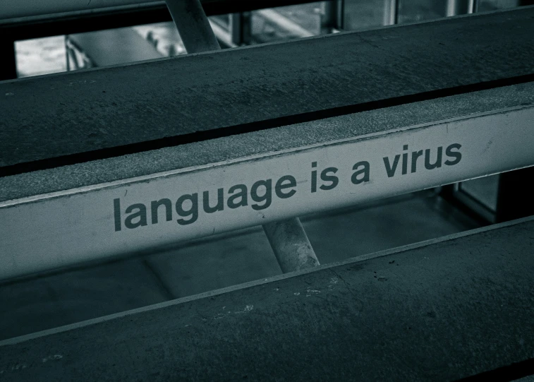 a sign showing language is a virtus