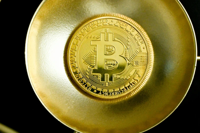 a golden plate with bitcoins on it