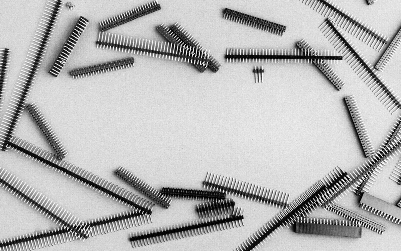 multiple black and white pographs with many metal hair combs