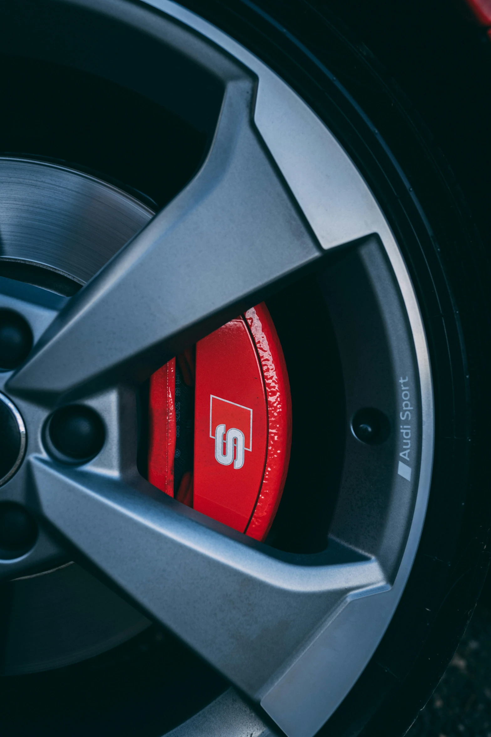 a tire with some red spokes in it