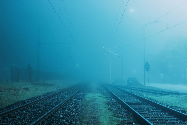 a train track with a few cars parked along side it