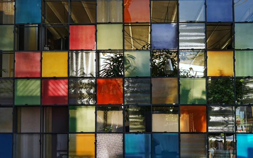 a colorful wall of multi - colored squares has an intricate pattern