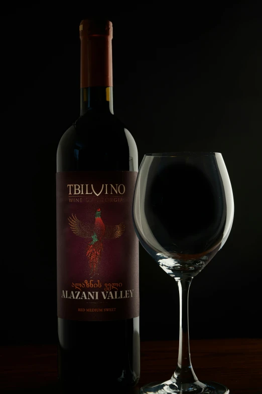 a glass and bottle of teblino