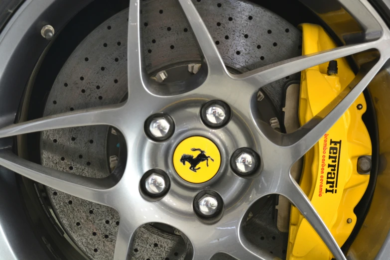 the wheels and rims of a car that is yellow and black