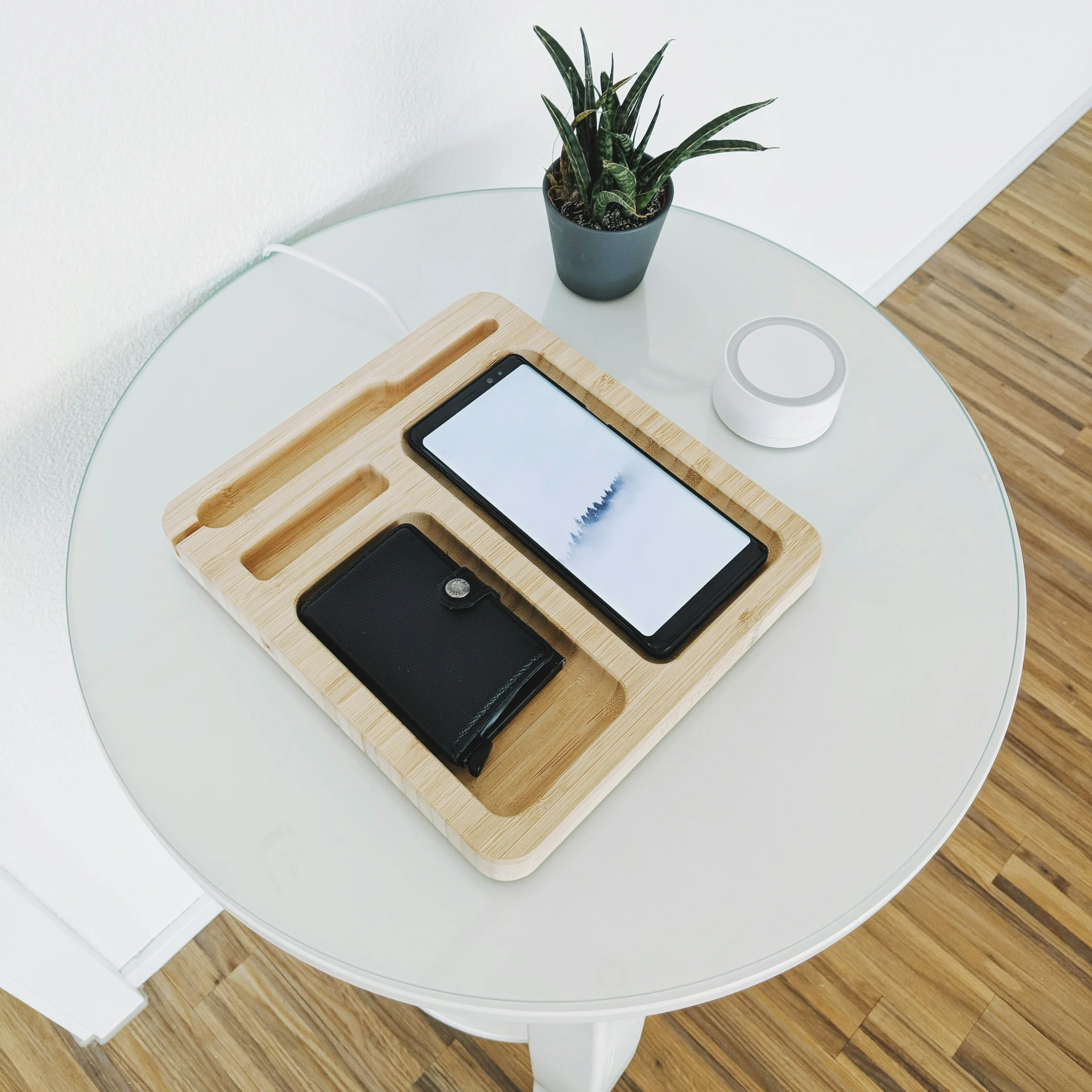 a table that has a phone and other things on it