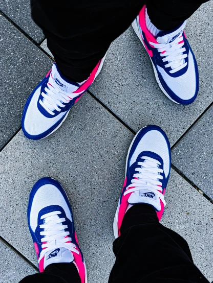 two people with blue and pink shoes on