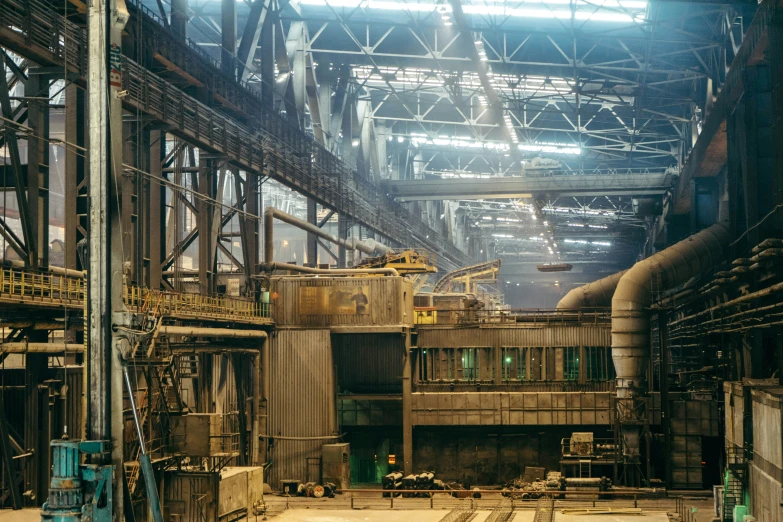 an industrial building with pipes, machinery and walls