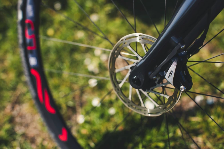 a close up view of the spokes on a bicycle