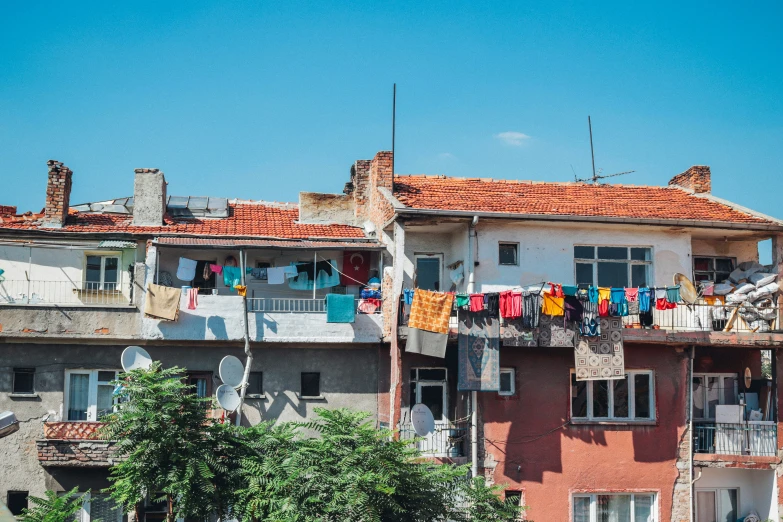 buildings with clothes hanging out to dry near trees
