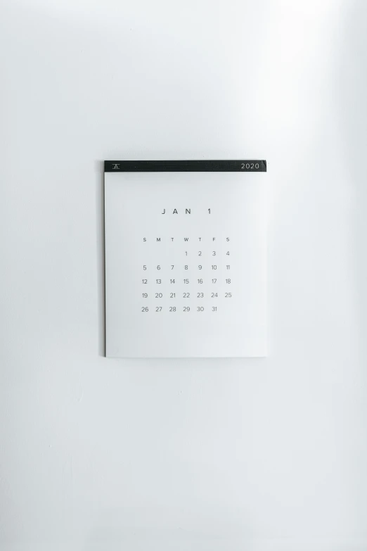 an abstract wall mounted calendar on a white wall