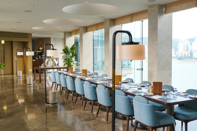 a dining area with chairs, tables, and lamps