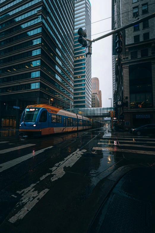 a train moving in the middle of some city buildings
