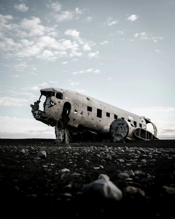 a big black and white plane is parked by itself