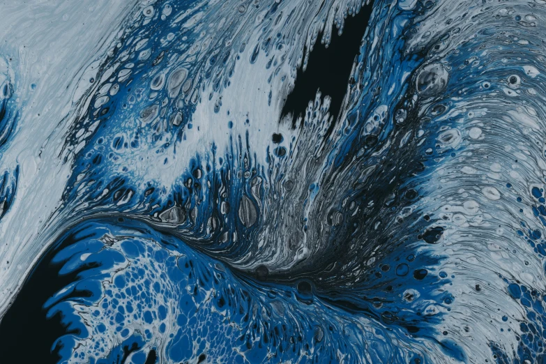 a large blue liquid splash art with white dots