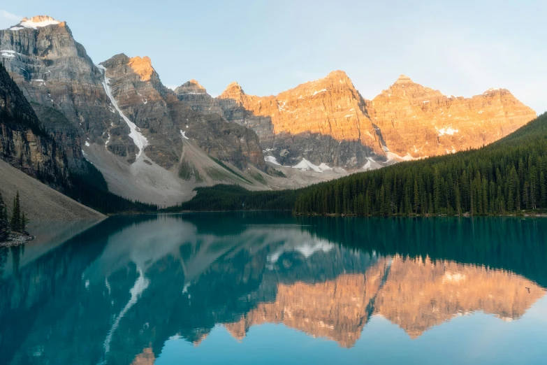 beautiful view of mountains and lake with reflection in the water