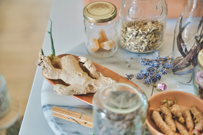 the table is cluttered with all kinds of foods