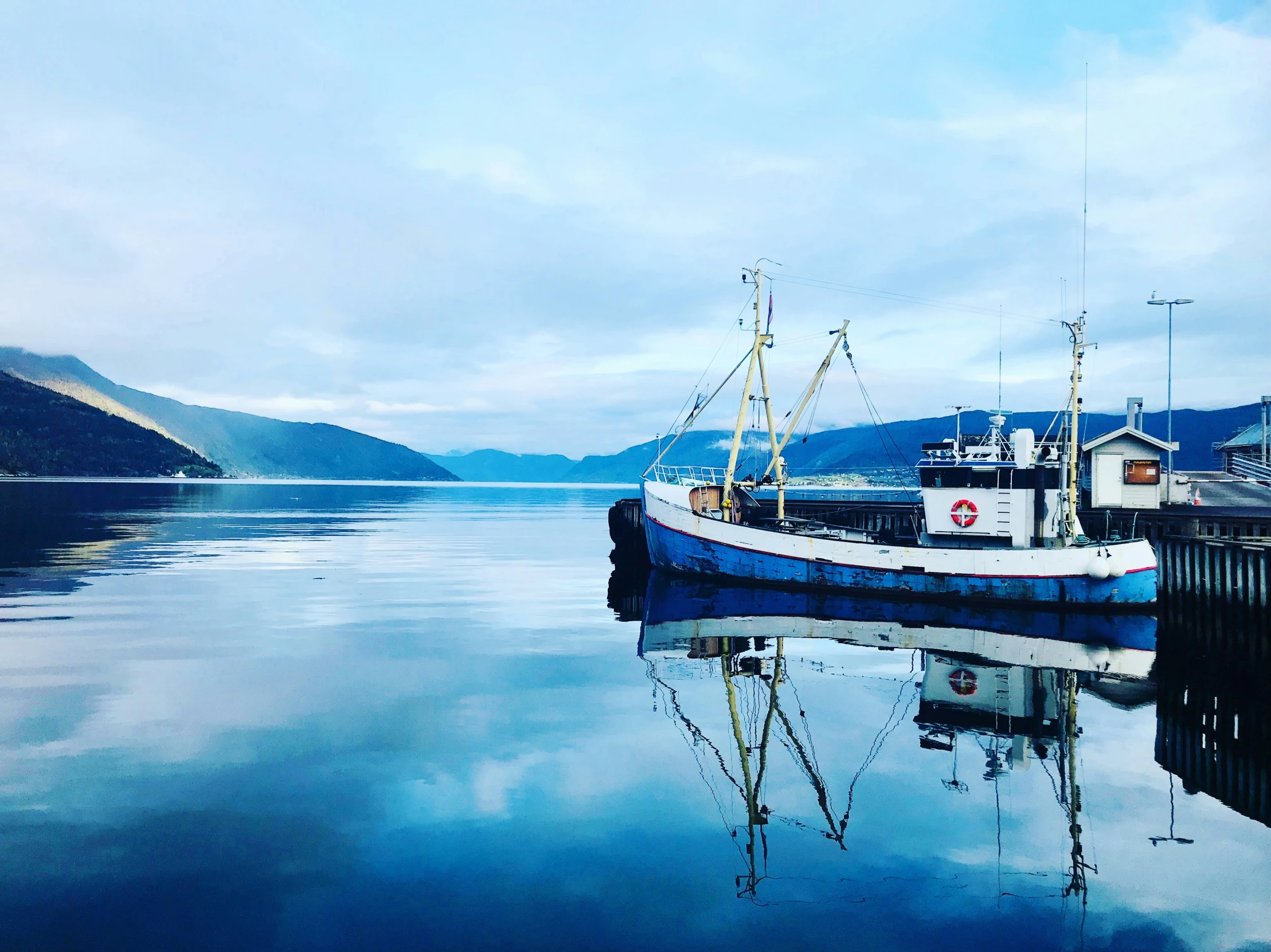 a boat floating on top of a body of water