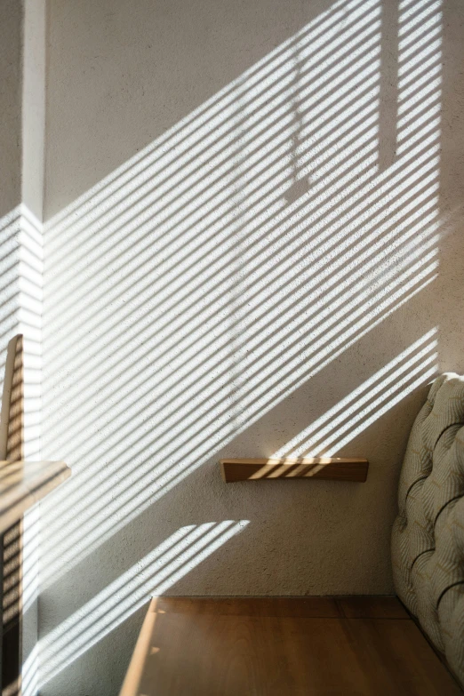 the shadow of a hanging cross on a wall