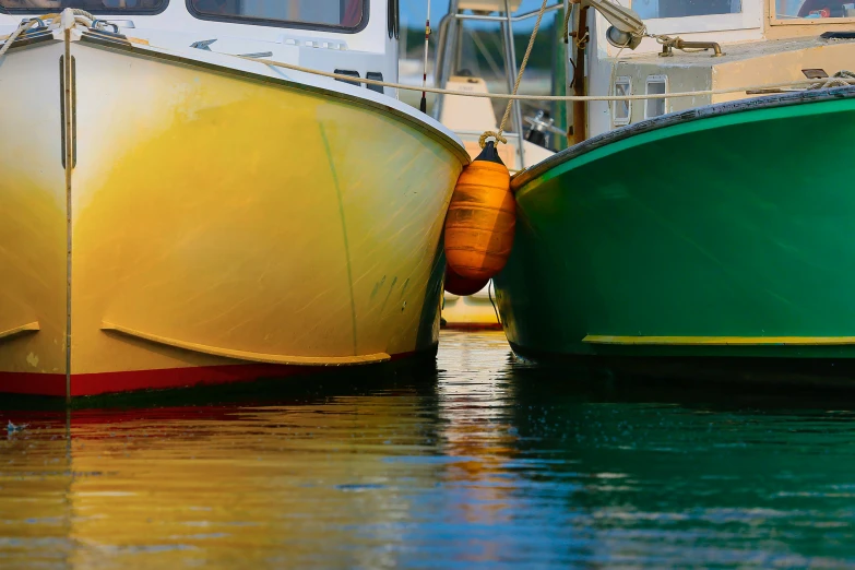 two fishing boats on the water at their dock