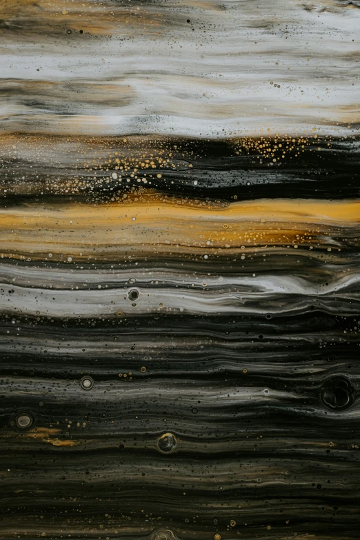 wet paint with yellow, brown, and black streaks