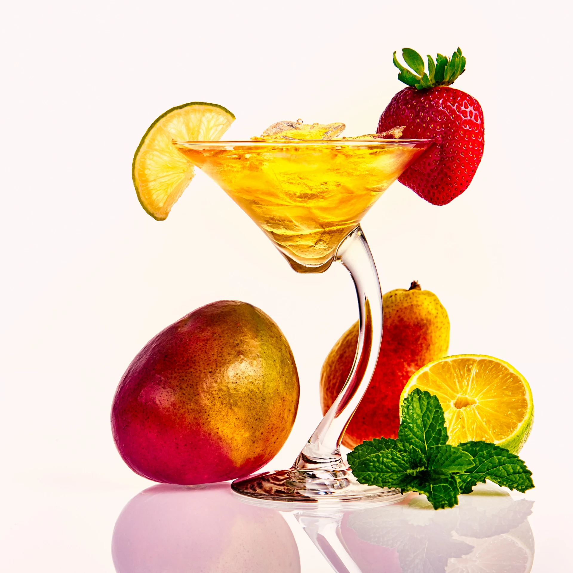 an orange and fruit drink garnished with lemon