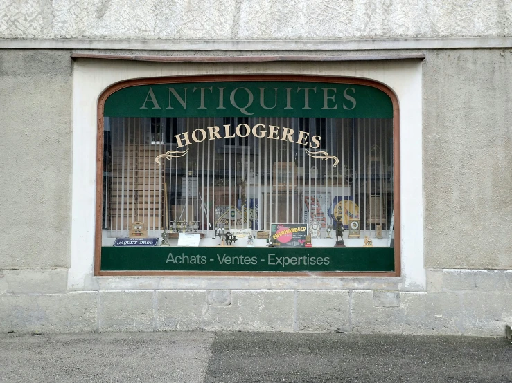 a large store window on the side of the street