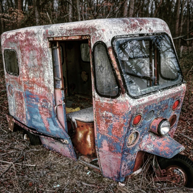 a van sitting on top of dry grass