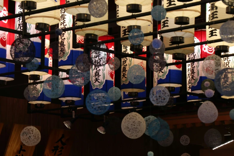 the glass display is filled with oriental writing