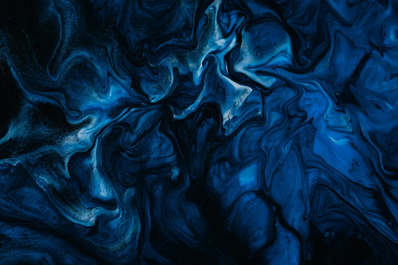 a blue texture of abstract paint painted on canvas