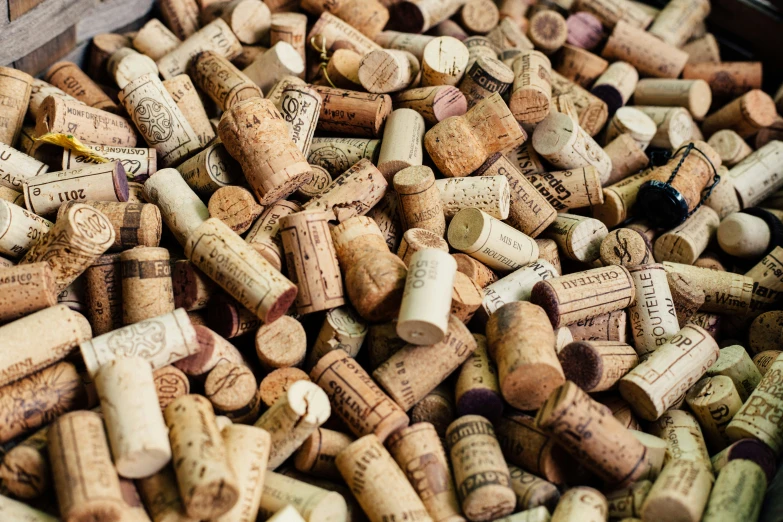 some corks are piled up in a pile