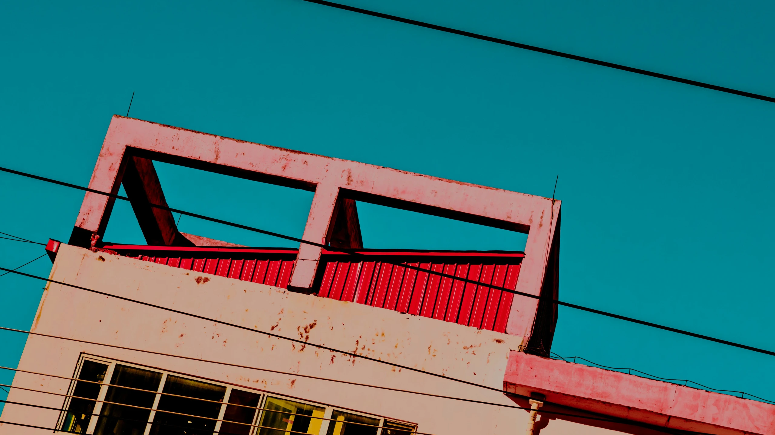 a building with some red trim and an orange cage