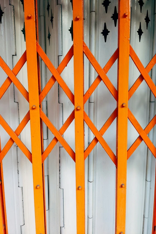 orange and white panels with black designs on them