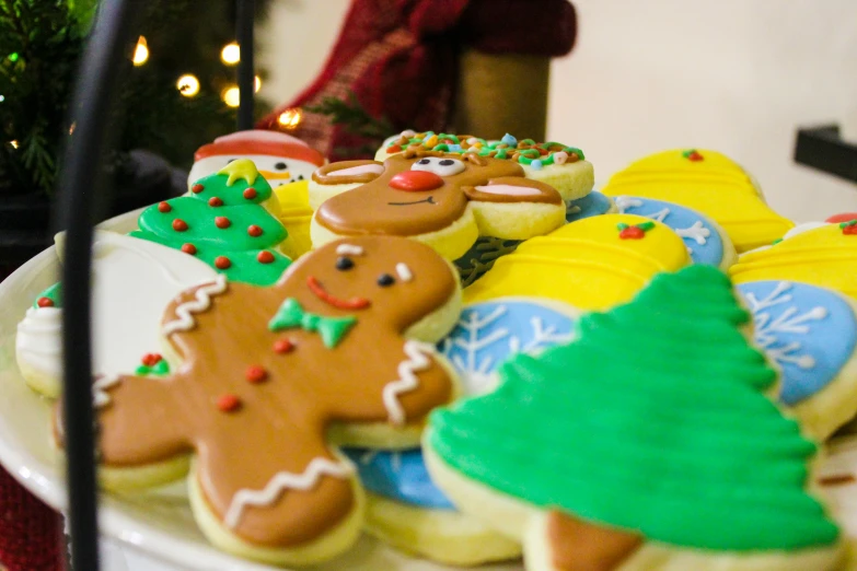 a white plate with decorated cookies on it