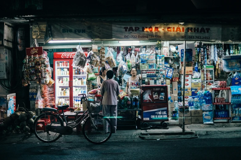 a person at a small shop selling items