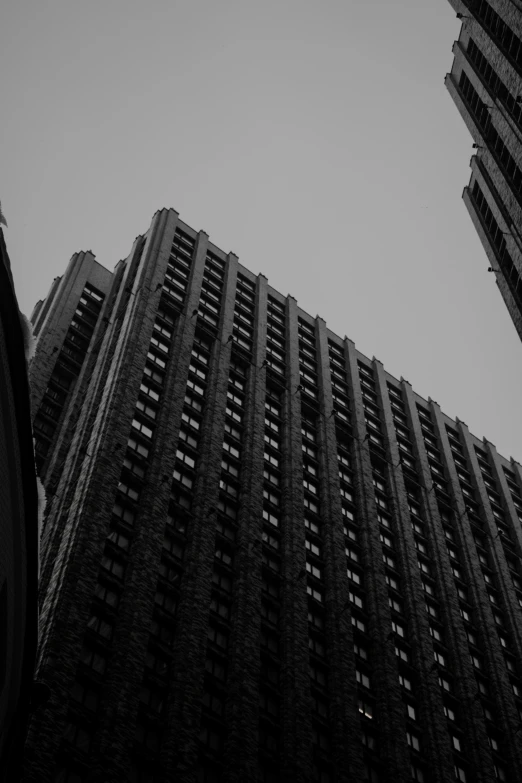 looking up at tall buildings in the city