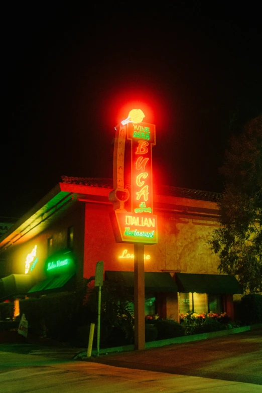 some neon lights that are on top of a restaurant